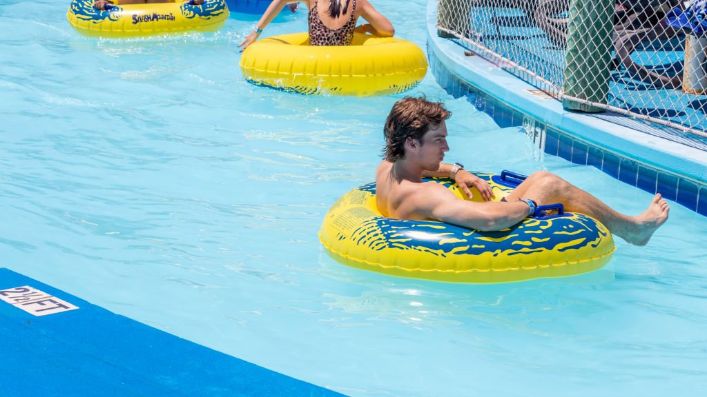 People in yellow tubes floating down the lazy river