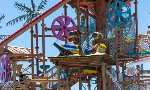 Elevated wooden playground with giant pirate head full of water