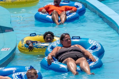 Groups of people floating down lazy river